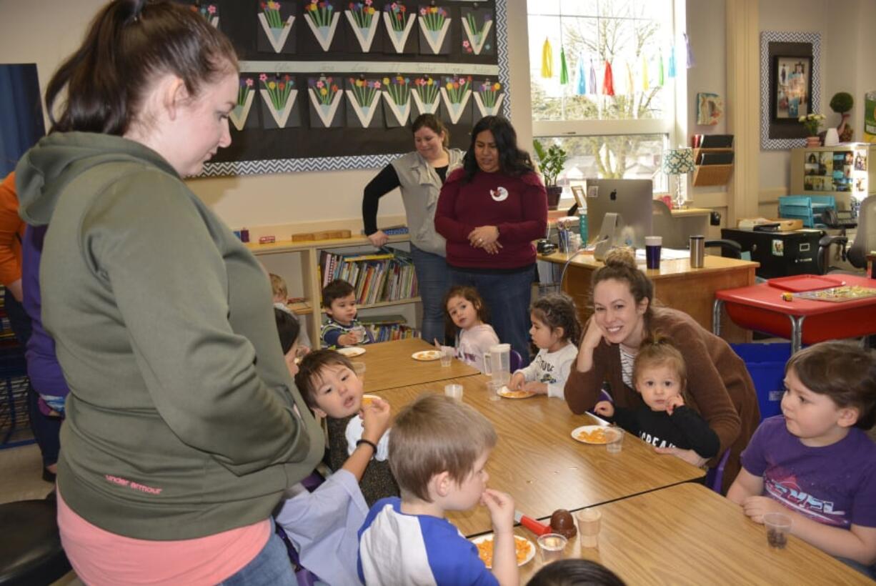 Washougal: Students enjoy snacks with their parents at Hathaway Elementary School in Washougal during a drop-in program through Educational Service District 112.