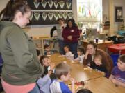 Washougal: Students enjoy snacks with their parents at Hathaway Elementary School in Washougal during a drop-in program through Educational Service District 112.