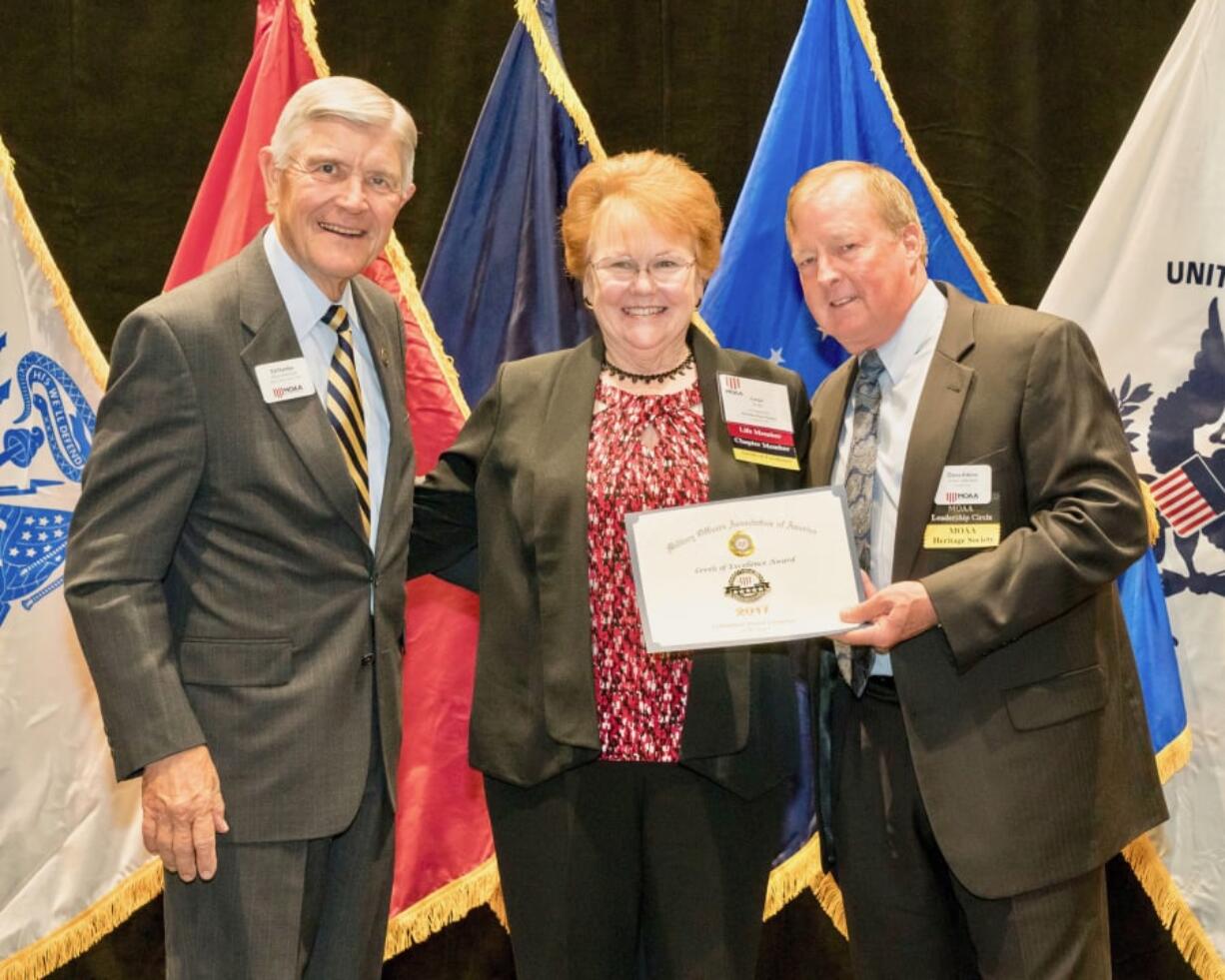 Northeast Hazel Dell: Columbia River chapter of the Military Officers Association of America President Evelyn Brady accepts the chapter’s 12th consecutive 5-Star Level of Excellence Award from the national organization.