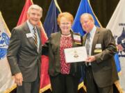 Northeast Hazel Dell: Columbia River chapter of the Military Officers Association of America President Evelyn Brady accepts the chapter’s 12th consecutive 5-Star Level of Excellence Award from the national organization.