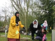 Salmon Creek: Volunteers at Earth Day Fest planted 1,085 trees, pulled garlic mustard and picked up trash all to help restore critical habitat for migratory salmon.