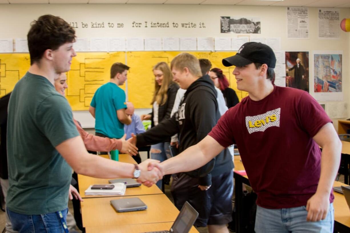 Woodland: Woodland High School AP Government students shake hands after participating in a debate over various Supreme Court cases that they had studied throughout the year.