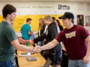 Woodland: Woodland High School AP Government students shake hands after participating in a debate over various Supreme Court cases that they had studied throughout the year.