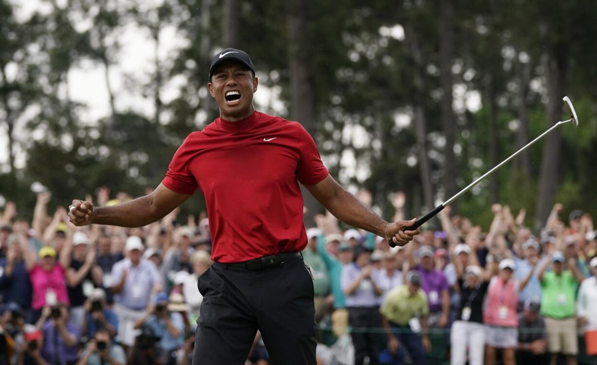 Tiger Woods reacts as he wins the Masters golf tournament Sunday, April 14, 2019, in Augusta, Ga. (AP Photo/David J.