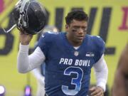 Russell Wilson of the Seattle Seahawks posted a video to social media early Tuesday, Apriil 16, 2019, saying, "Seattle, we got a deal," shortly after a reported midnight deadline for the Seahawks and their star quarterback to agree on a contract extension. (AP Photo/Phelan M.