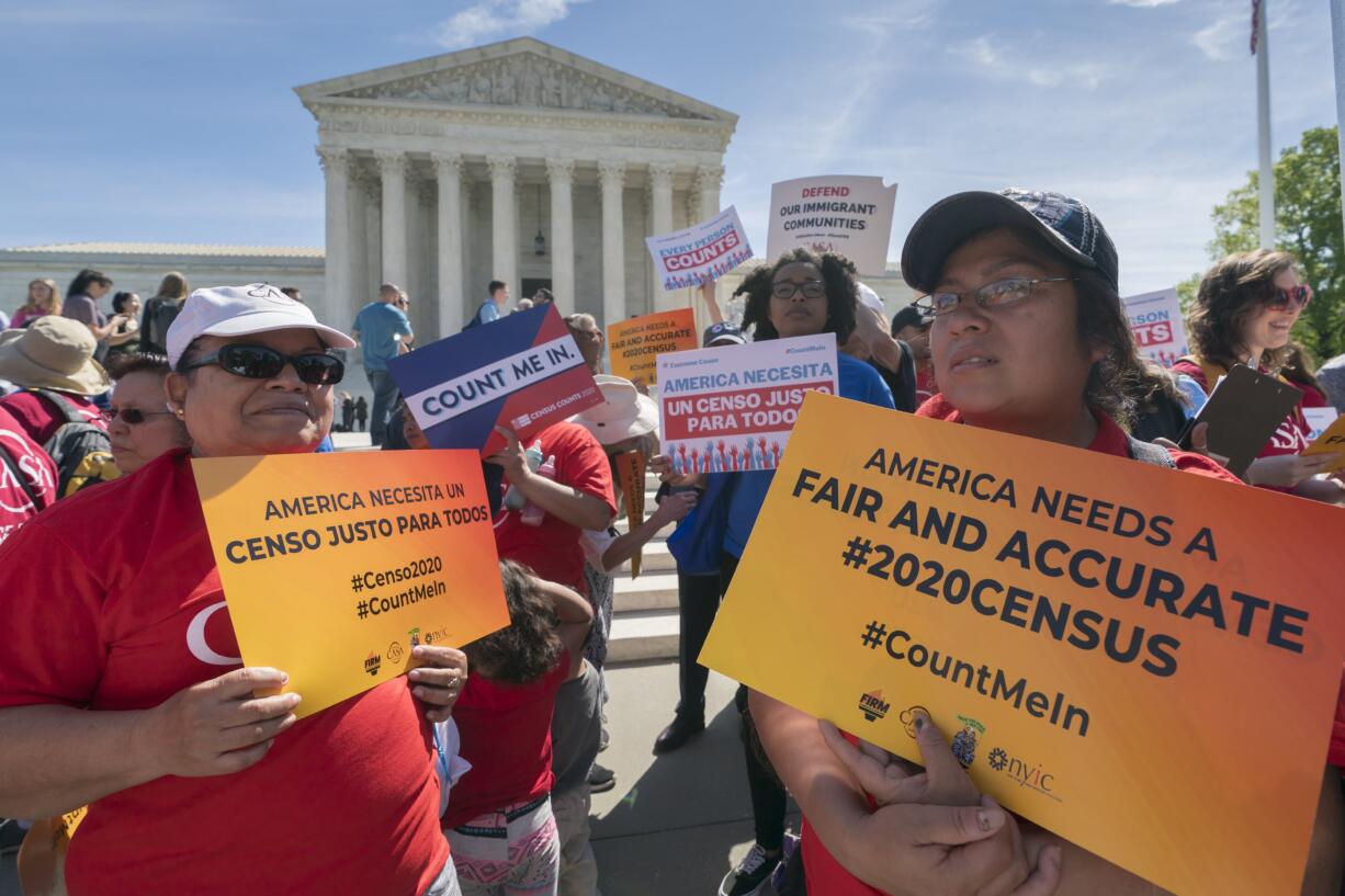 Immigration activists rally outside the Supreme Court as the justices hear arguments over the Trump administration's plan to ask about citizenship on the 2020 census, in Washington, Tuesday, April 23, 2019. Critics say the citizenship question on the census will inhibit responses from immigrant-heavy communities that are worried the information will be used to target them for possible deportation. (AP Photo/J.