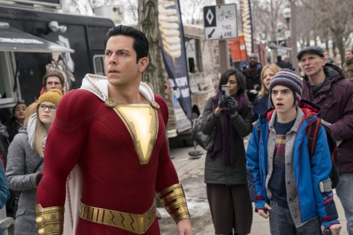 Zachary Levi, left, and Jack Dylan Grazer in a scene from “Shazam!” Steve Wilkie/Warner Bros.