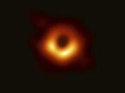 This image released Wednesday, April 10, 2019, by Event Horizon Telescope shows a black hole. Scientists revealed the first image ever made of a black hole after assembling data gathered by a network of radio telescopes around the world.