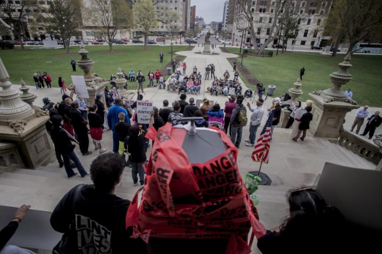 More than 50 Flint residents rally on the five-year anniversary of the Flint water crisis at the Capitol Building on Thursday, April 25, 2019, in Lansing, Mich.