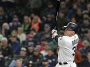 Seattle Mariners' Jay Bruce watches his solo home run during the eighth inning of the team's baseball game against the Cleveland Indians, Tuesday, April 16, 2019, in Seattle. (AP Photo/Ted S.