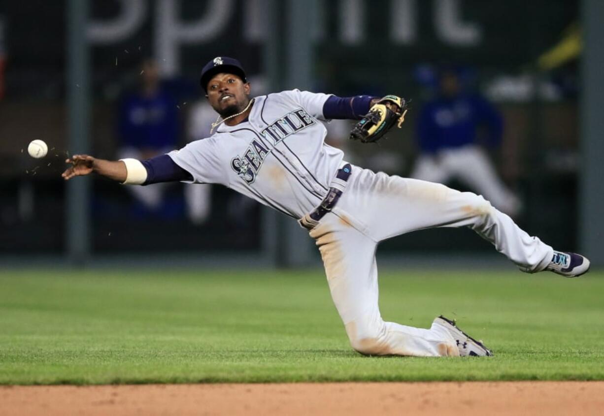 Seattle Mariners second baseman Dee Gordon throws out Kansas City Royals’ Martin Maldonado during the seventh inning of a baseball game at Kauffman Stadium in Kansas City, Mo., Tuesday, April 9, 2019.