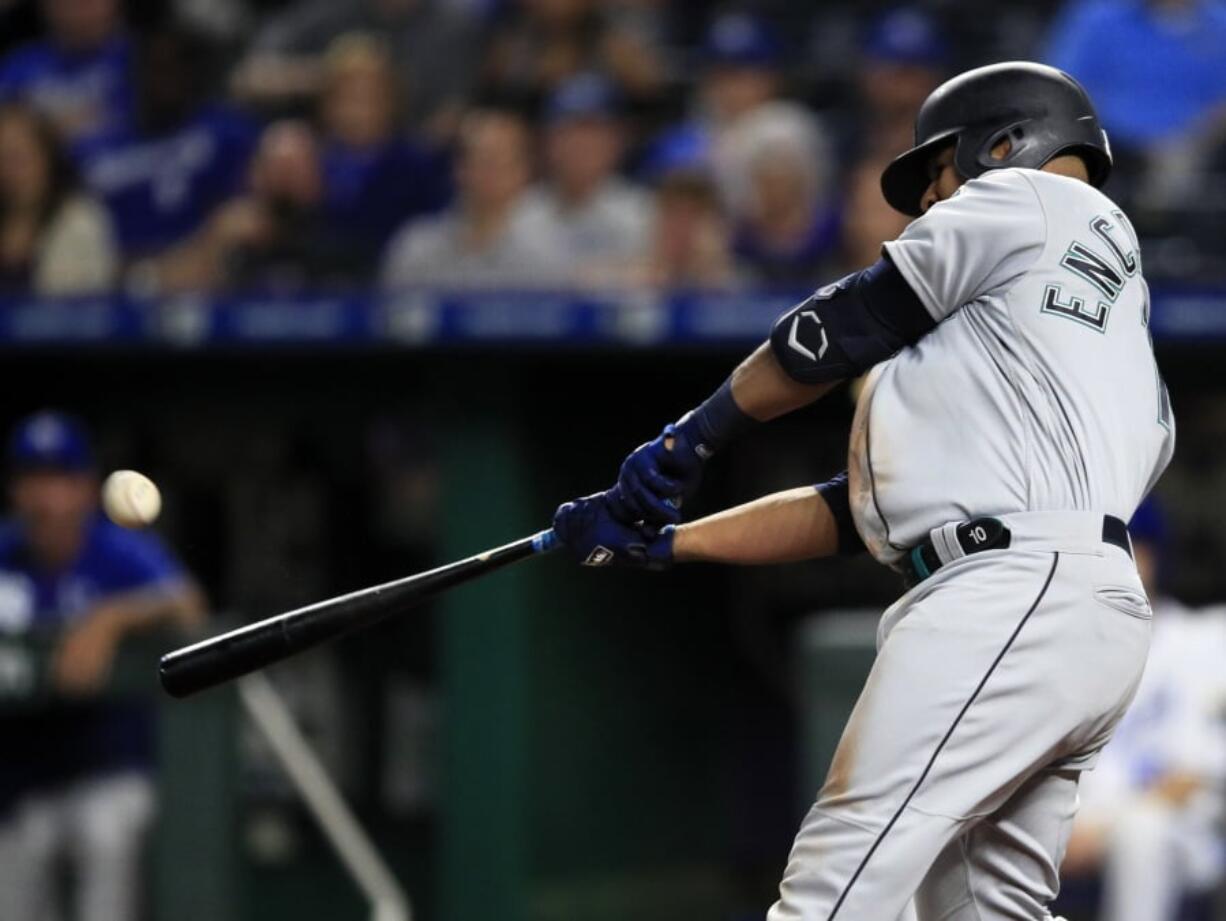 Seattle Mariners first baseman Edwin Encarnacion hits a three-run home run off Kansas City Royals relief pitcher Kevin McCarthy during the sixth inning of a baseball game at Kauffman Stadium in Kansas City, Mo., Monday, April 8, 2019. It was the second home run of the inning for Encarnacion.