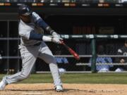 Seattle Mariners’ Tim Beckham (1) hits a three-run home run against the Chicago White Sox during the fifth inning of a baseball game in Chicago, Saturday, April 6, 2019.