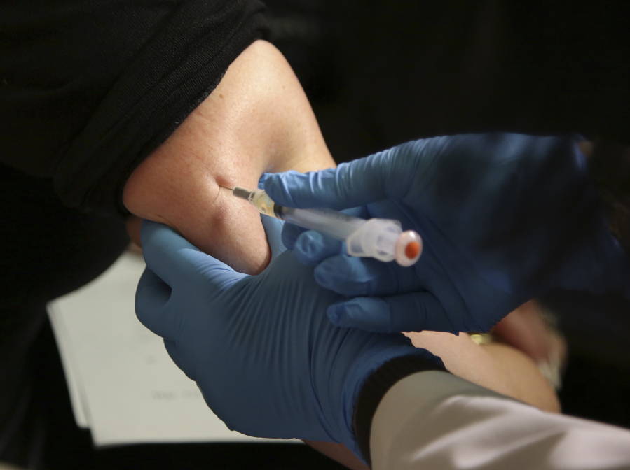 A woman receives a measles, mumps and rubella vaccine March 27 at the Rockland County Health Department in Pomona, N.Y. The Centers for Disease Control and Prevention reports that U.S. measles cases have surged this year, and at this pace will set a record for most illnesses in 25 years. Nearly two-thirds of the cases reported have been in New York, and most of those have been unvaccinated people in Orthodox Jewish communities.