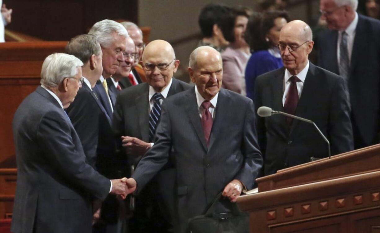 The Church of Jesus Christ of Latter-day Saints President Russell M. Nelson, center, greets the conference of The Church of Jesus Christ of Latter-day Saints Saturday, April 6, 2019, in Salt Lake City.