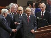 The Church of Jesus Christ of Latter-day Saints President Russell M. Nelson, center, greets the conference of The Church of Jesus Christ of Latter-day Saints Saturday, April 6, 2019, in Salt Lake City.