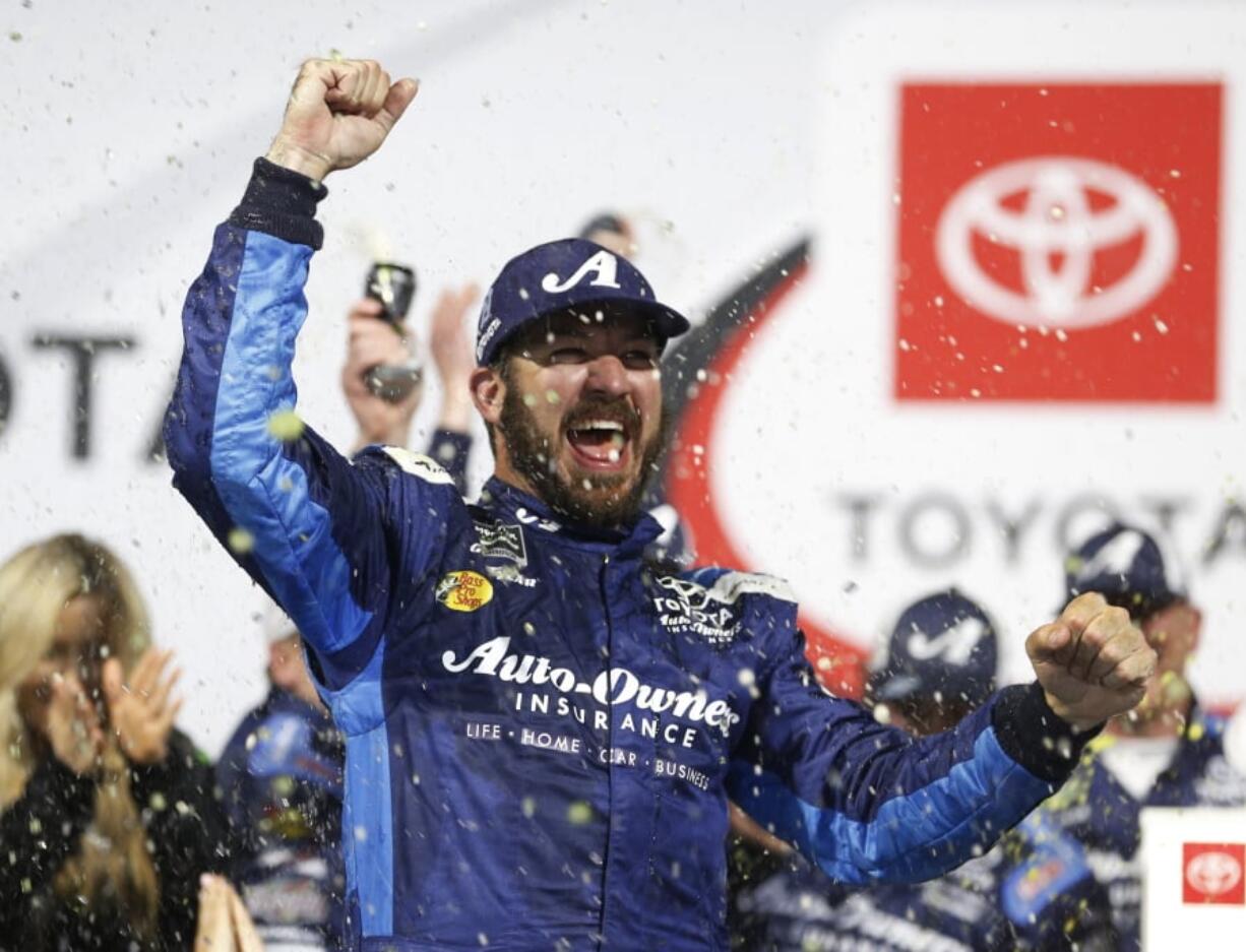 Martin Truex Jr. celebrates in Victory Lane after winning the NASCAR Cup Series auto race at Richmond Raceway in Richmond, Va., Saturday, April 13, 2019.