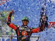 Chase Elliott celebrates after winning a NASCAR Cup Series auto race at Talladega Superspeedway, Sunday, April 28, 2019, in Talladega, Ala.