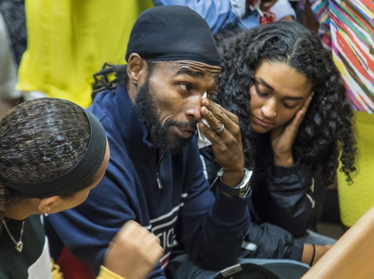 Clinton “C. J.” Jones, brother of Corey Jones, wipes his eyes after Nouman Raja was sentenced to 25 years in prison Thursday in West Palm Beach, Fla.