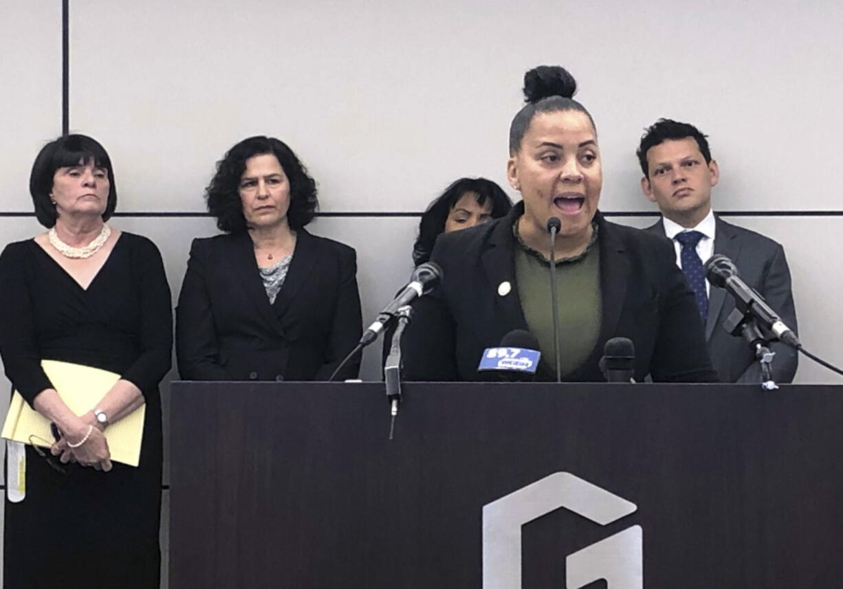 Suffolk District Attorney Rachael Rollins speaks during a news conference announcing a plan to file a federal lawsuit against U.S. Immigration and Customs Enforcement, Monday, April 29, 2019, in Boston, over its policy of arresting people at courthouses on civil immigration matters. The announcement comes days after federal prosecutors charged a judge and former court officer in Newton, Mass., with obstruction of justice for allegedly helping a man wanted by federal immigration authorities escape a courthouse.