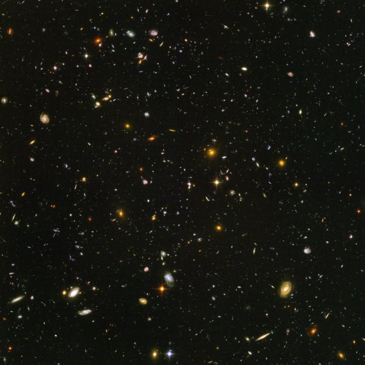 This image made from a composite of September 2003 to January 2004 photos captured by the NASA/ESA Hubble Space Telescope shows nearly 10,000 galaxies in the deepest visible-light image of the cosmos, cutting across billions of light-years. NASA, ESA, S.