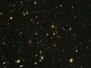 This image made from a composite of September 2003 to January 2004 photos captured by the NASA/ESA Hubble Space Telescope shows nearly 10,000 galaxies in the deepest visible-light image of the cosmos, cutting across billions of light-years. NASA, ESA, S.