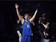 Dallas Mavericks’ Dirk Nowitzki acknowledges cheers from fans as he walks off the court following the team’s NBA basketball game against the Phoenix Suns in Dallas, Tuesday, April 9, 2019. The team honored Nowitkzi, who played his final home game of his 21-year career.