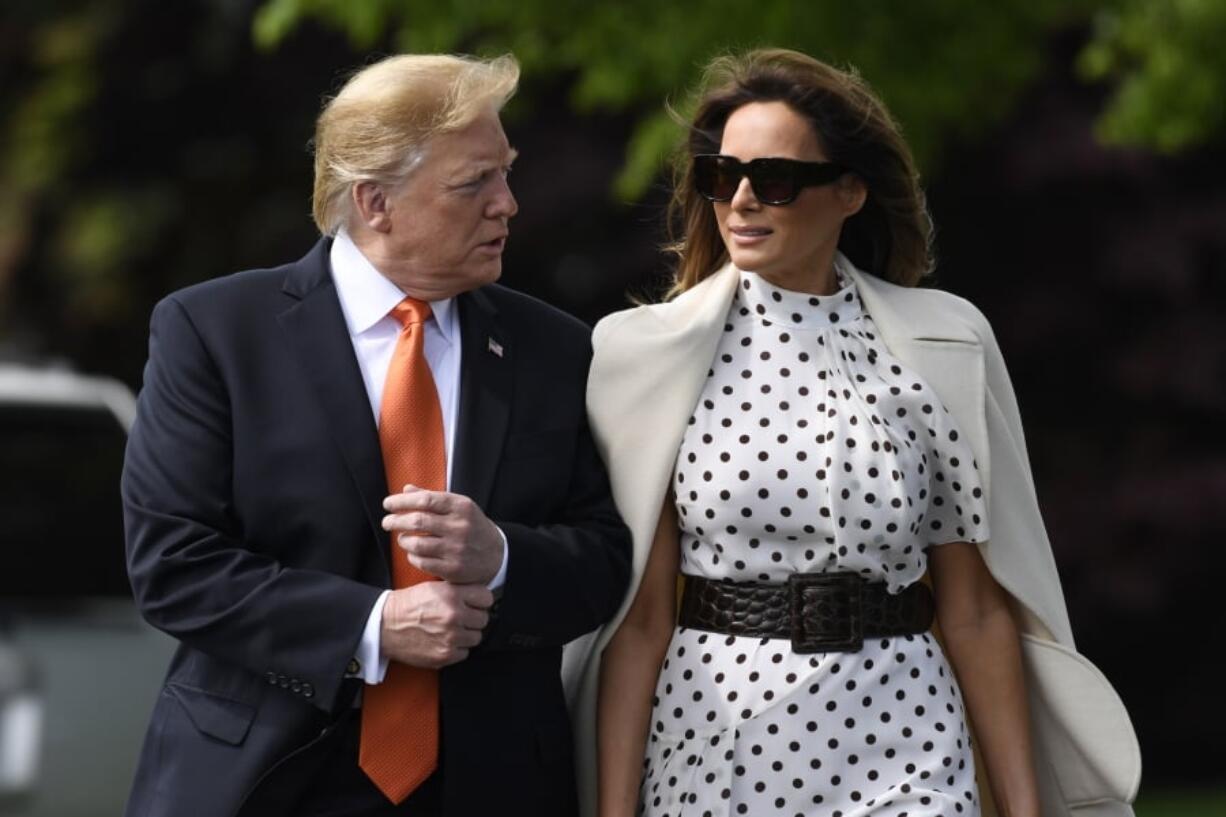 President Donald Trump and first lady Melania Trump walk to Marine One on the South Lawn of the White House in Washington, Wednesday, April 24,2019. The Trumps are traveling to Atlanta to speak at a summit on drug abuse.