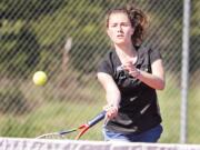 Union junior Miriam Muntean drops in a shot against Camas sophomore Rachel Merrill in a 6-1, 6-2 victory at No. 1 singles in a dual match Wednesday in Camas. Muntean will pair with Nicole Knudtson in hopes of making a deep postseason run for the Titans.