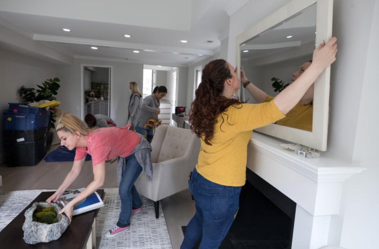 Stagers from Red House Staging and Interiors prepare a home for sale in the District of Columbia.