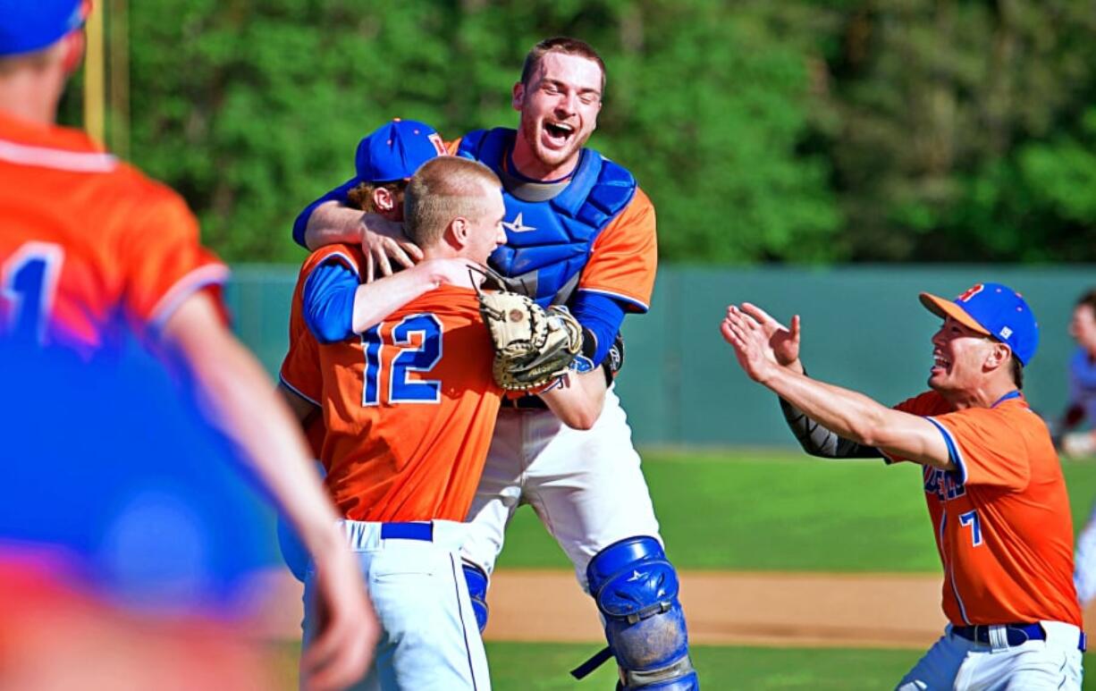 The members of the Ridgefield baseball team celebrate their 1-0 win over W.F. West on Wednesday, clinching a berth to the state tournament.