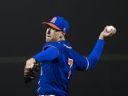 Ridgefield’s Kellen Bringhurst pitches against Kalama at the new Ridgefield Outdoor Recreation Complex Friday, March 8, 2019.