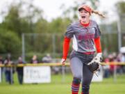 Ridgefield’s Kaia Oliver celebrates the final out of a 6-5 win over W.F. West on Friday, just two days after coach Dusty Anchors died from heart disease.