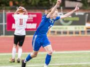 Mountain View sophomore Nathan Purvis celebrates his game-sealing goal in a 2-0 win over Kamiakin in the 3A State quarterfinals Saturday at McKenzie Stadium. Braves defender Dyson Hawkins holds his head in disbelief at the 72nd-minute strike.