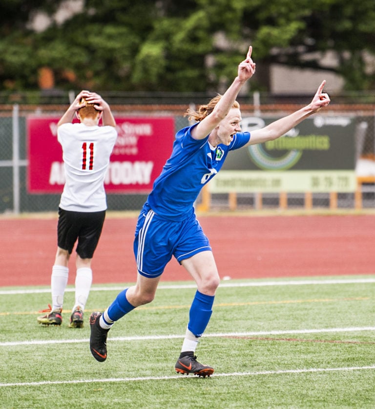 Mountain View sophomore Nathan Purvis celebrates his game-sealing goal in a 2-0 win over Kamiakin in the 3A State quarterfinals Saturday at McKenzie Stadium. Braves defender Dyson Hawkins holds his head in disbelief at the 72nd-minute strike.