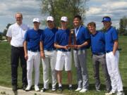 The Ridgefield boys golf team holds the Class 2A state championship trophy on Wednesday in Spokane. The Spudders won the title after all six golfers made the cut Tuesday. Kellen Bringhurst, third from right, placed fourth overall.