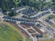 New homes under construction are seen near Woodburn Elementary School in 2016.