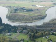 An aerial view of the East Fork of the Lewis River near La Center shows some of the problems the river faces, including banks with little or no vegetation to shade its water.