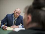 Volunteer lawyer Eli Marchbanks listens as Debra Lepak expresses her concerns and asks questions about upcoming court procedures tied to the garnishment of her income due to unpaid medical bills. Marchbanks is one of about 100 attorneys who help clients through the Clark County Volunteer Lawyers Program.