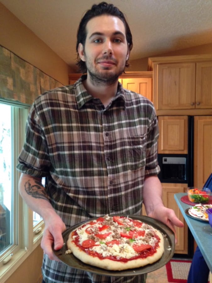 Zach Moritz poses for a photo at a Super Bowl party a few months before he died.