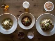 The Dungeness crab ravioli, left, Nonnie’s meatballs, center, and the bacon wrapped meatloaf, right, at Three Sixty Kitchen.