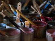 Many colorful mixtures of encaustic (beeswax) and dammar resin sit Tracy Simpson’s home studio in Washougal, ready to go; all she has to do is melt them, or make some more, to start adding colors to her works in progress.