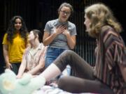 Camas High School theater students Sara Akhtarkhavari, from left, Laura Johnson and Cameron Kolkemo console Rae, the main character played by fellow student Chloe Higgins, during a rehearsal.