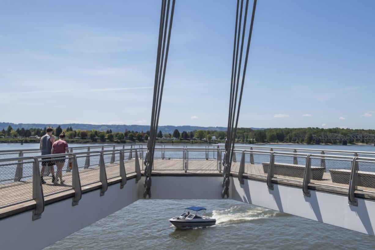 Kobe Lee, left, and Camille Cowles of Vancouver walk along the Grant Street Pier. The spectacular Columbia River overlook might seem like the perfect place to cast a fishing line, but a city official says the pier’s height makes fishing unsafe.