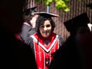 Kassidy Young of Vancouver gathers with her fellow graduates during Saturday’s Washington State University Vancouver commencement ceremony at Sunlight Supply Amphitheater.