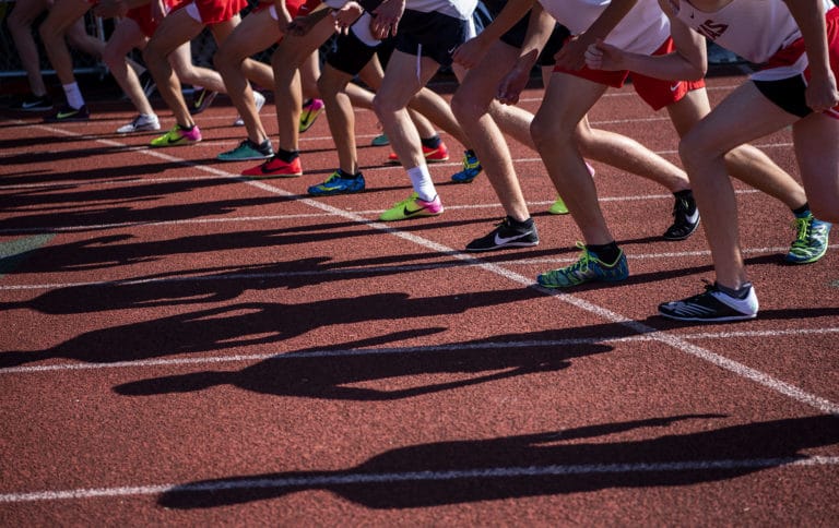 Runners line up for the menÕs Class 4A 1600 meter run during the Class 3A and 4A district track and field meet at McKenzie Stadium in Vancouver on Wednesday, May 8, 2019.