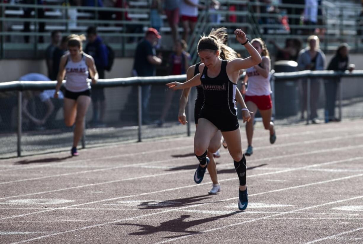 Union’s Logan Nelson wins the 200 meter dash during the Class 3A and 4A district track and field meet.