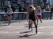 Union’s Logan Nelson wins the 200 meter dash during the Class 3A and 4A district track and field meet.