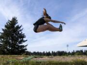 Evergreen’s Bailey Cunningham competes in the long jump during the Class 3A and 4A district track and field meet.