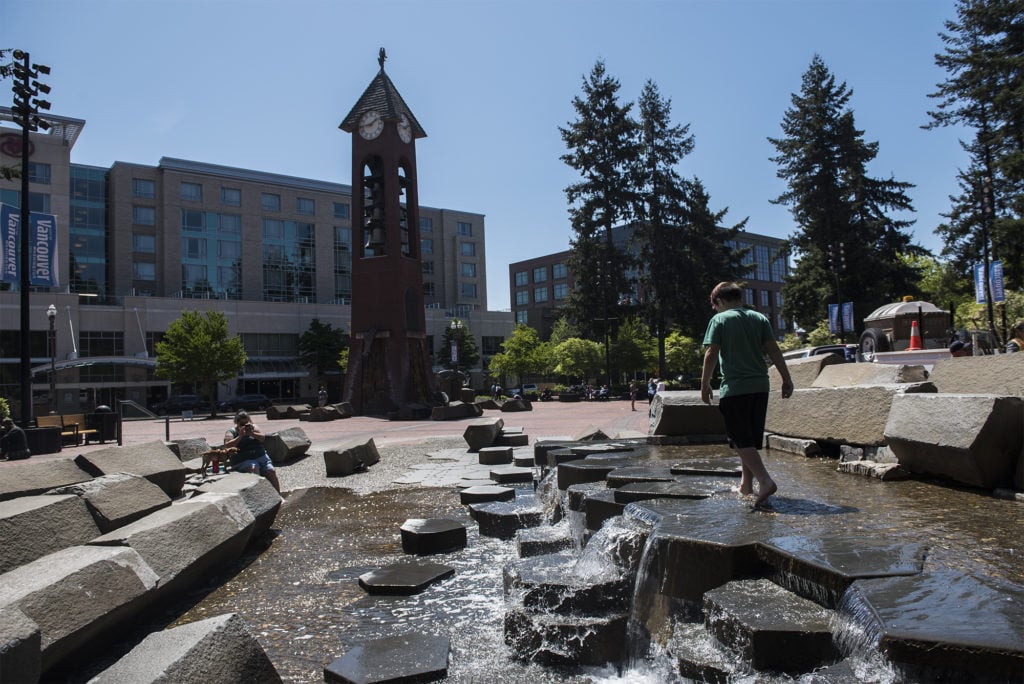 Evan Peek, 8, of Vancouver walks along the water feature in Esther Short Park.